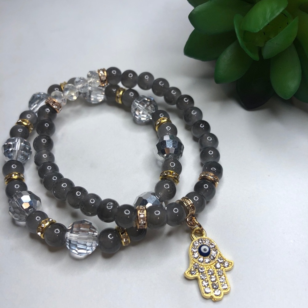 Grey beaded bracelet gold accents Hamsa charm
